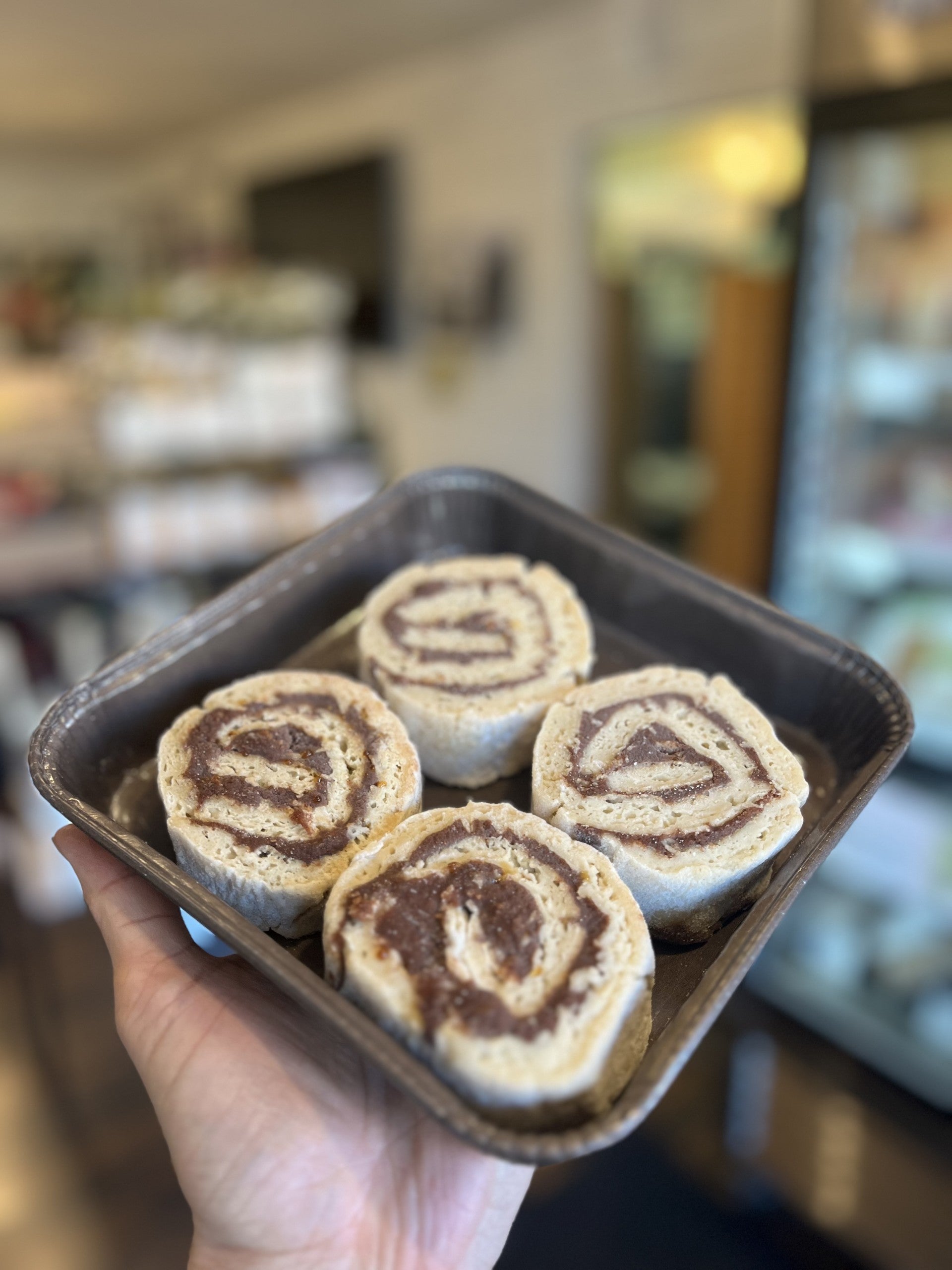 Behind the counter at the bakery